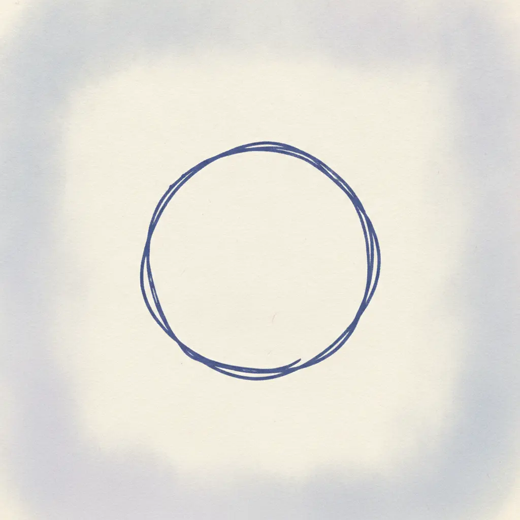 Un cercle dessiné à la main, légèrement imparfait, laissé tel quel sur le papier.